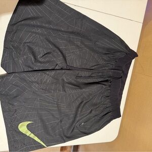 Nike Black Athletic Shorts with Gold Swoosh